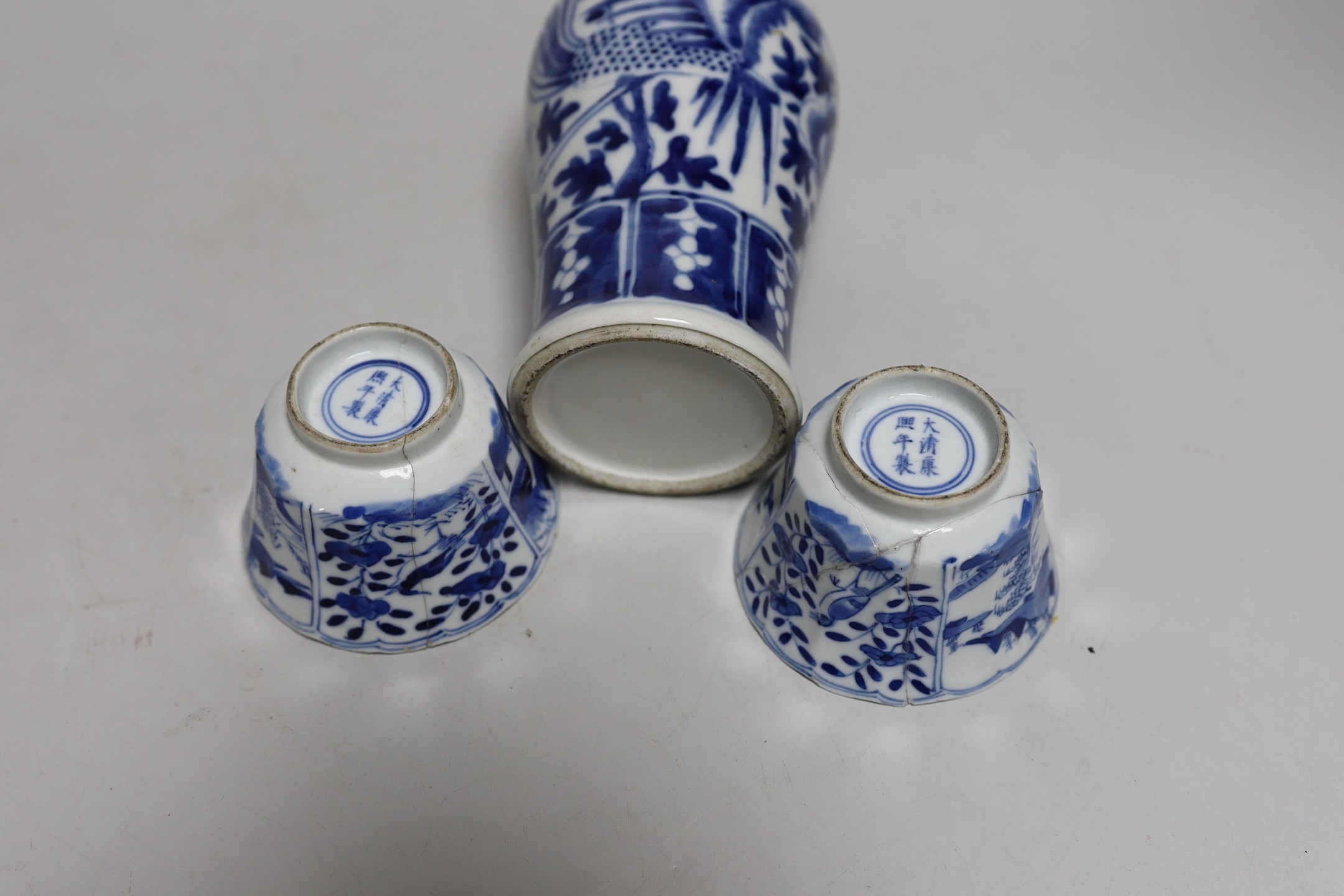 A Chinese blue and white phoenix decorated vase, a pair of circular boxes and a pair of damaged tea bowls. Late 19th century Tallest 17.5cm